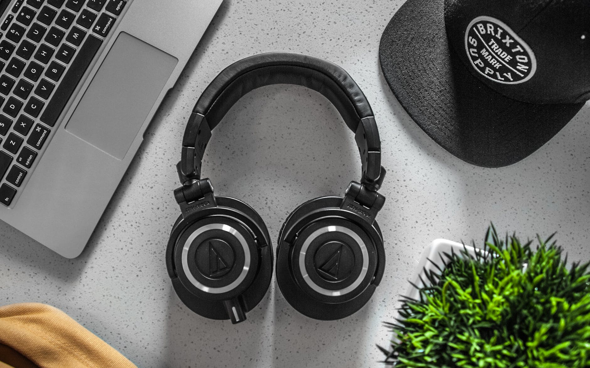 black wireless headphones on white table